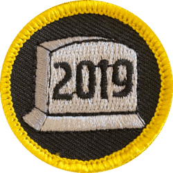 Bright embroidered badge with "2019" for haunted attraction awards or team-building pins.