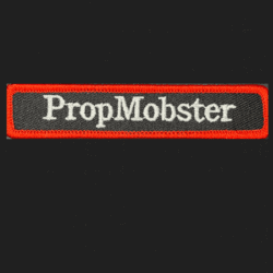 PropMobster haunted attraction team-building badge in pumpkin orange color.