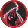 Haunted attraction badge with lightning and spooky face design, perfect for team-building.