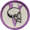 Haunted attraction badge with skull and purple accents for team-building events.