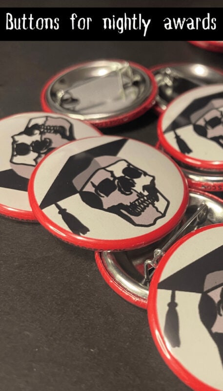 Skull-themed haunted attraction merit badges with red borders and black and white designs.