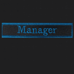 Manager embroidered badge with blue text on black background, suitable for haunted attraction staff.