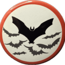 Haunted bat and bat wing silhouettes on a white badge with red border.